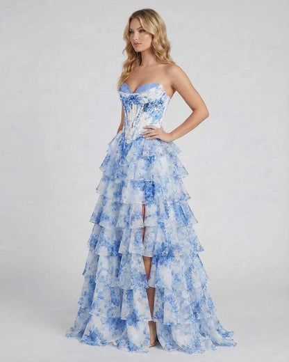 Mara Maxi Dress by RAMBLION featuring a strapless bodice, tiered chiffon skirt, and beautiful blue floral design, perfect for elegant occasions.