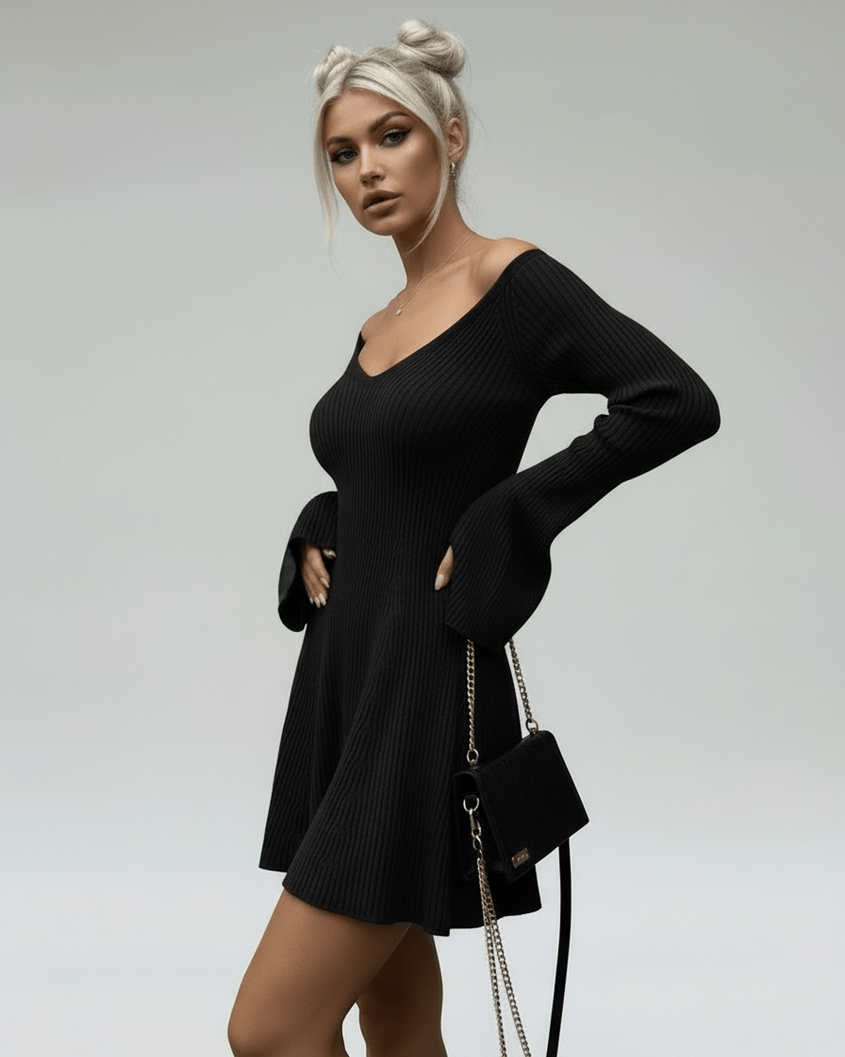 Maya Mini Dress in black cotton, featuring a V-neck design and flared sleeves by RAMBLION, perfect for chic occasions.