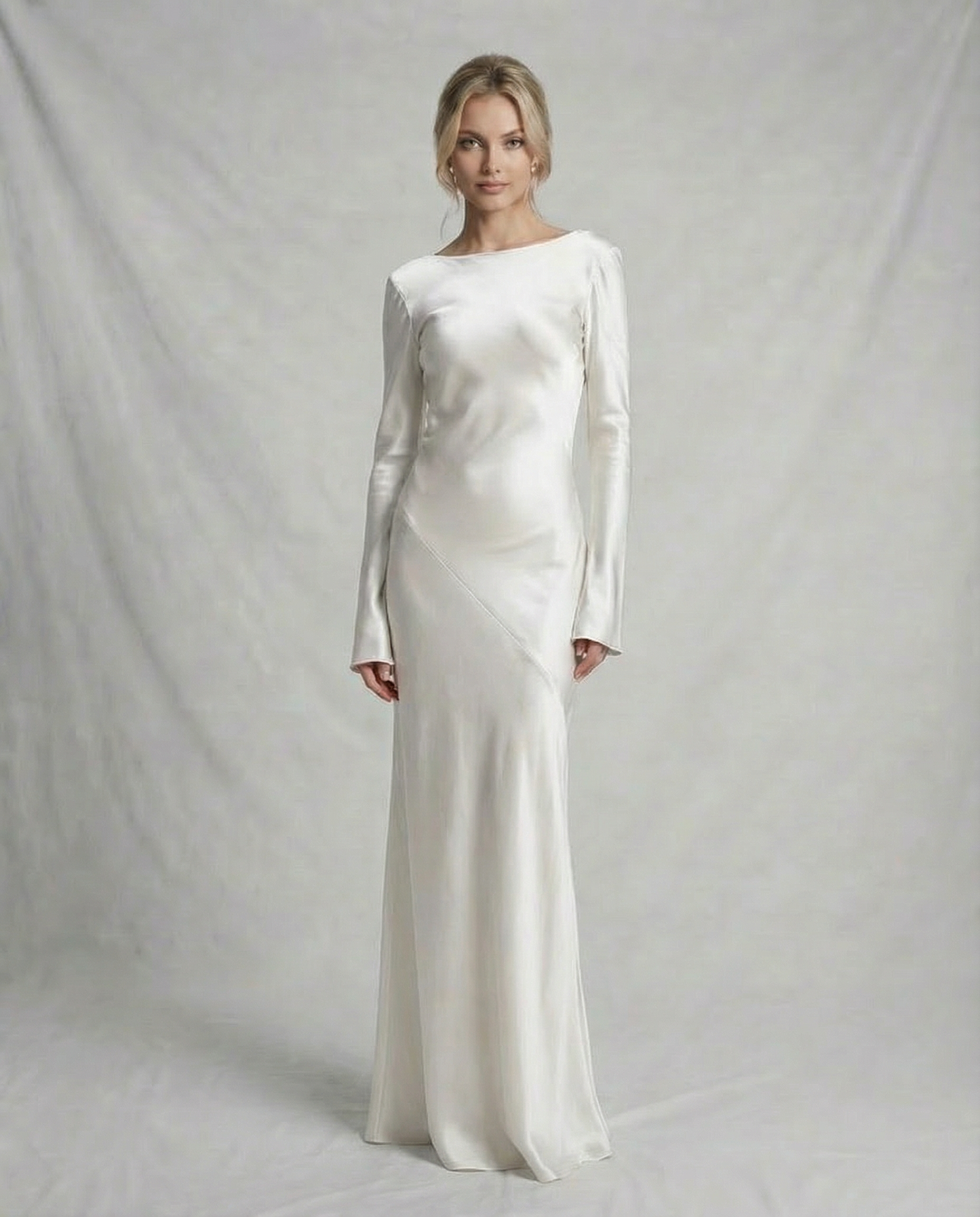 Meda Maxi Dress with elegant satin texture, long sleeves, and low draped back, perfect for special occasions by RAMBLION.