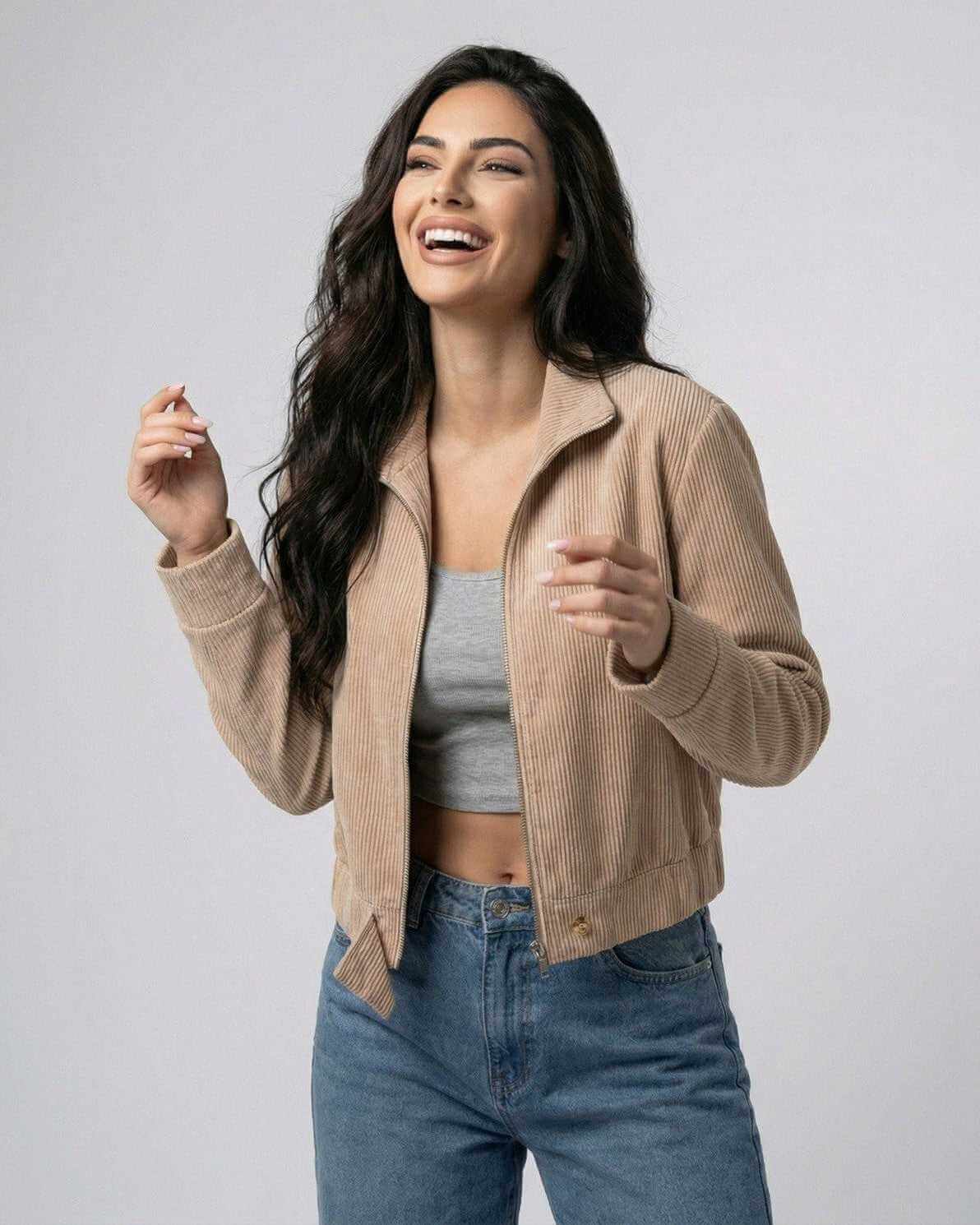 Smiling model wearing a beige Meva Jacket, featuring soft material perfect for casual outings, by RAMBLION.