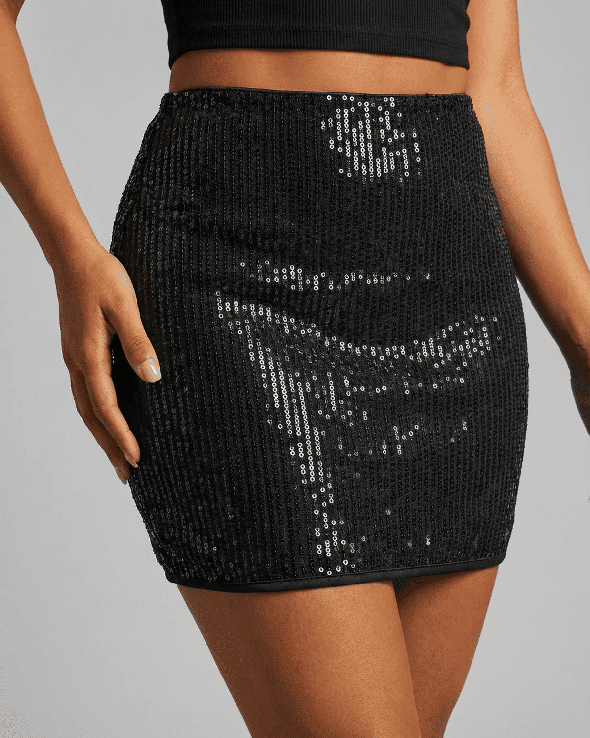 Meva Mini Skirt featuring a stunning black sequin overlay, perfect for chic evening outings by RAMBLION.