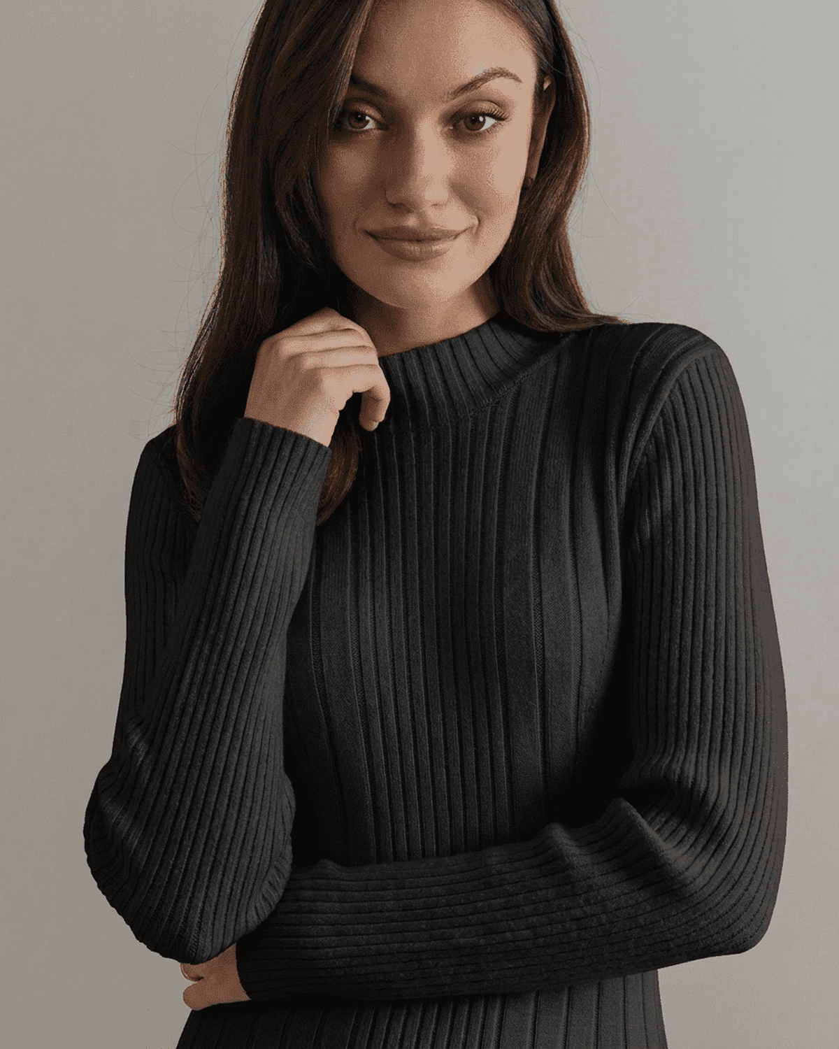 Close-up of a model wearing the Milano Mini Dress, showcasing the ribbed knit and mock neck design.