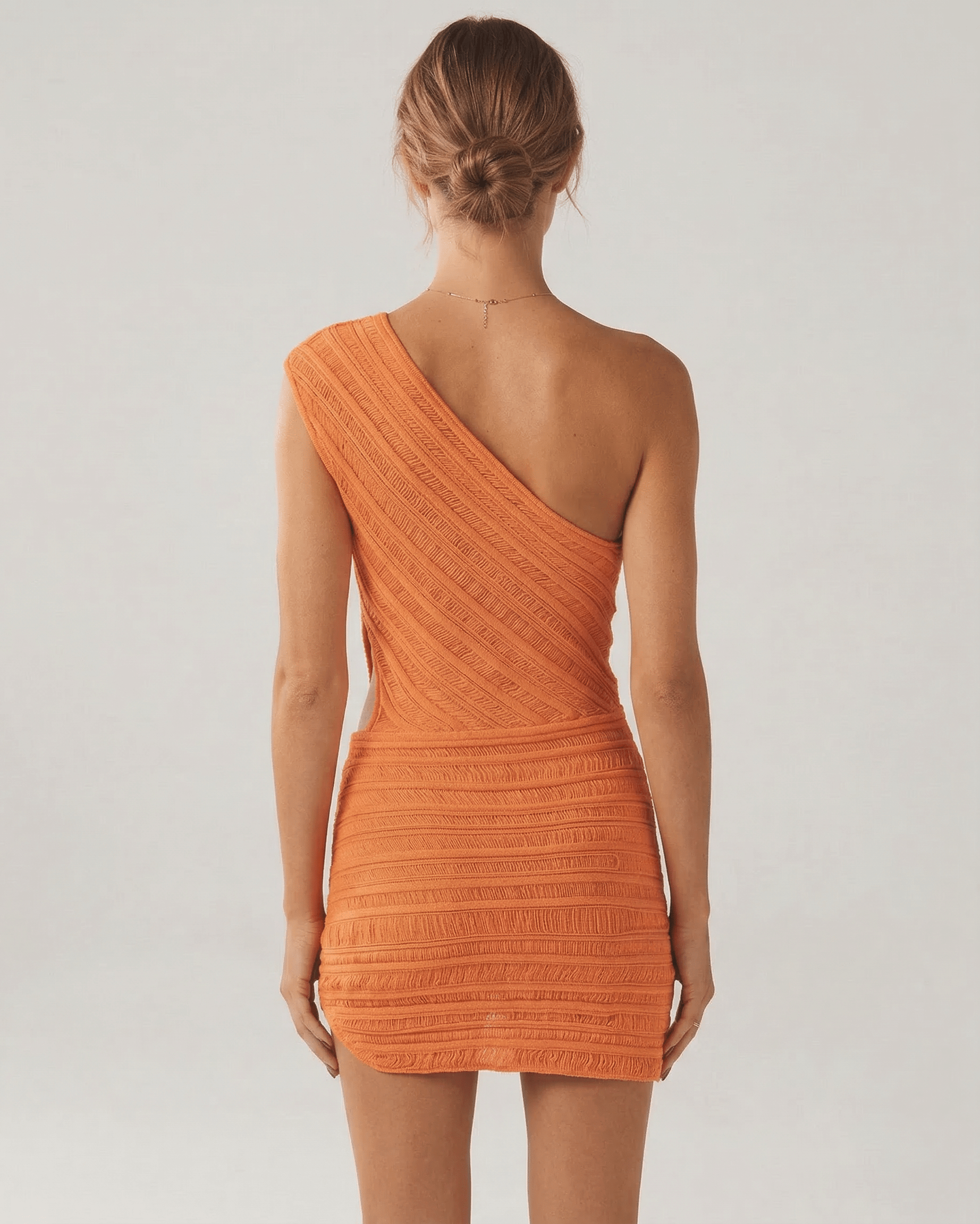 Naia Mini Dress by RAMBLION, radiant orange, halter design, soft ribbed texture, perfect for modern fashion lovers.