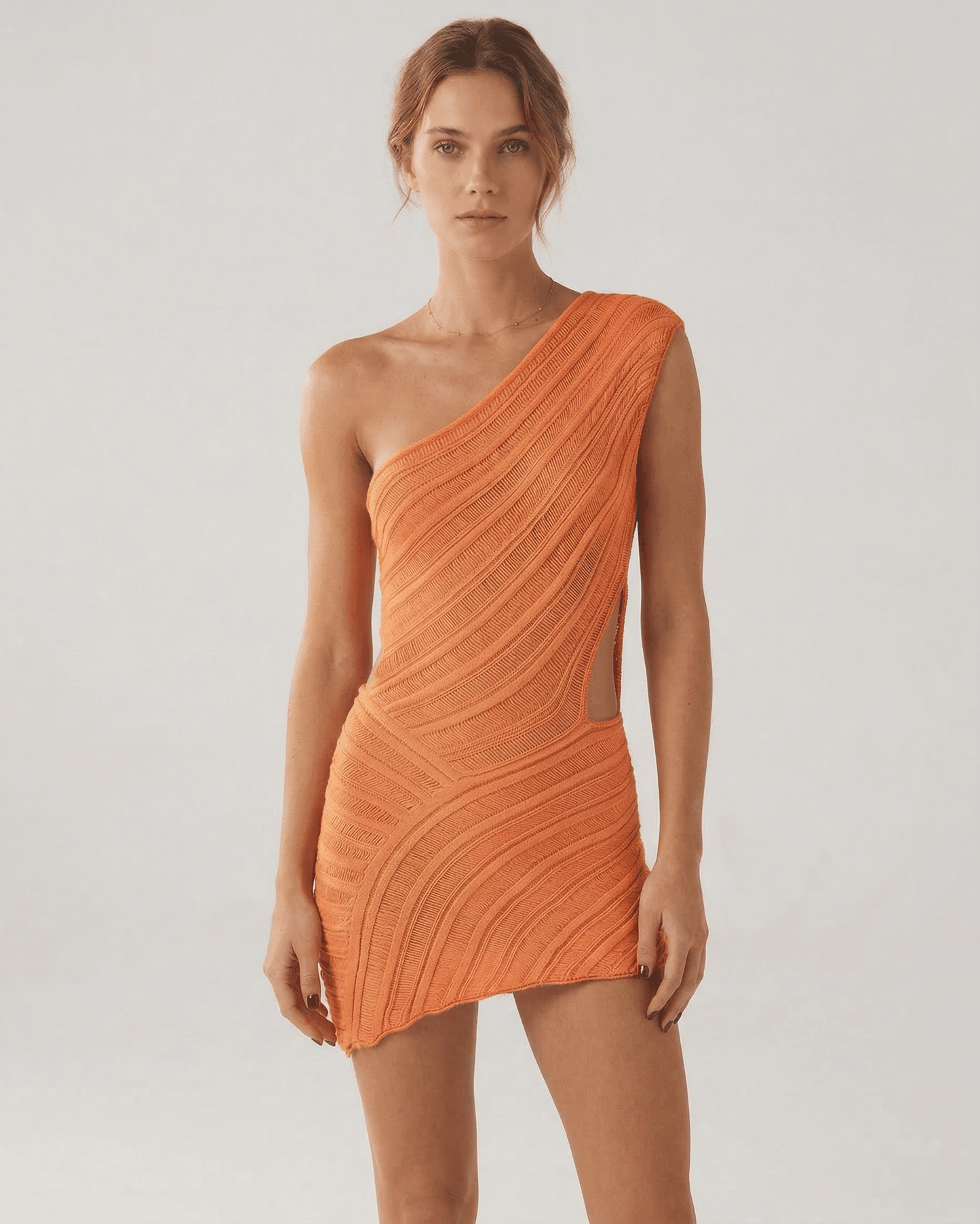Naia Mini Dress by RAMBLION in radiant orange, featuring a modern silhouette and soft ribbed texture, perfect for bold fashion lovers.