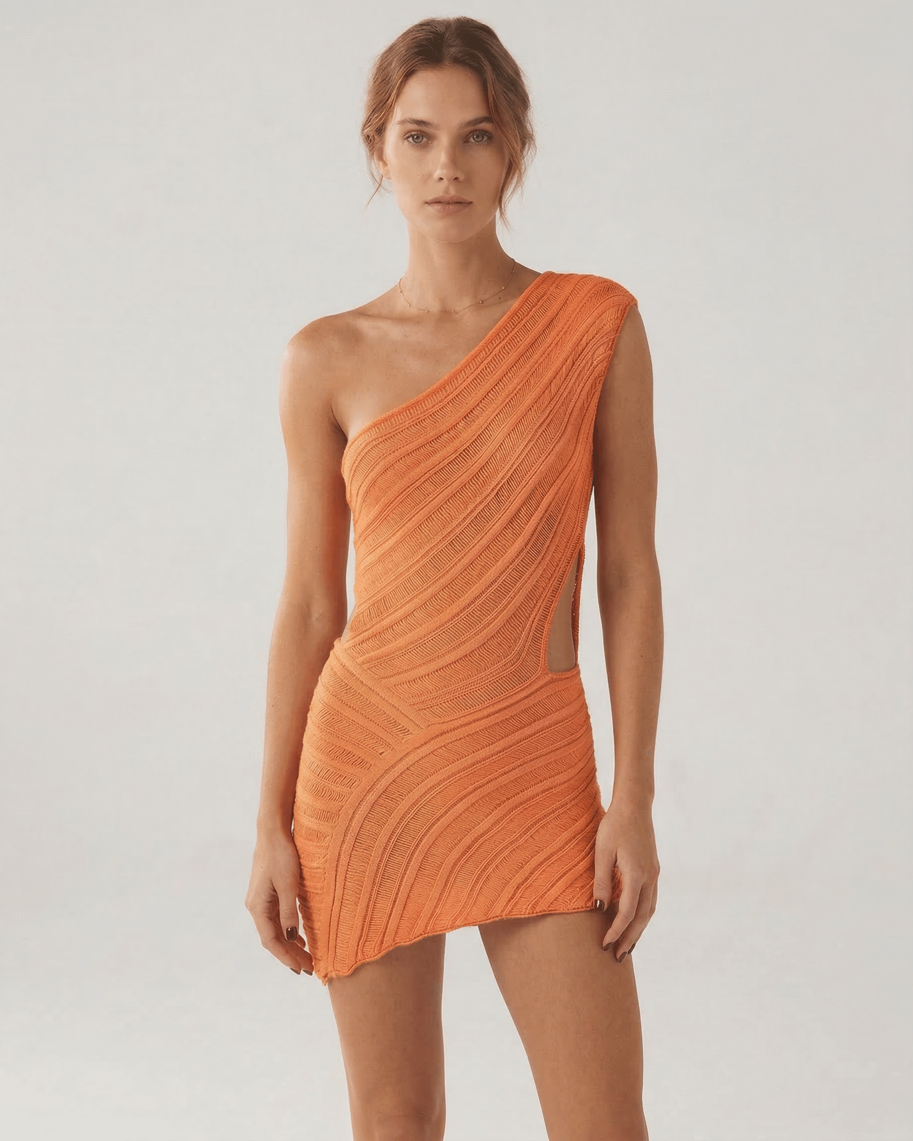 Naia Mini Dress by RAMBLION in radiant orange, featuring a modern silhouette and soft ribbed texture, perfect for bold fashion lovers.