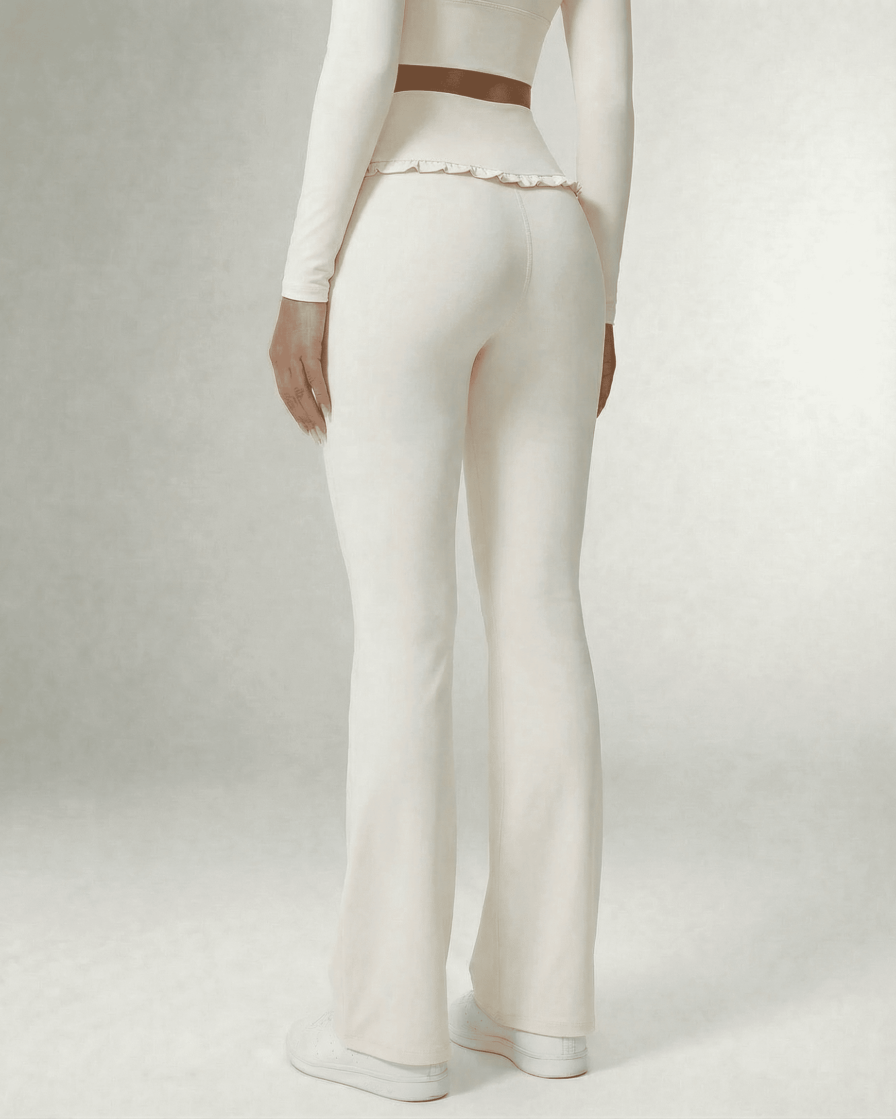 Back view of a model wearing Naid Leggings by RAMBLION in elegant white, perfect for workouts and casual outings.