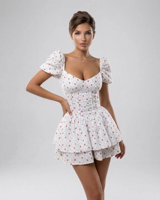 Nima Mini Dress by RAMBLION: white cotton denim, floral print, A-line, perfect for warm weather occasions.