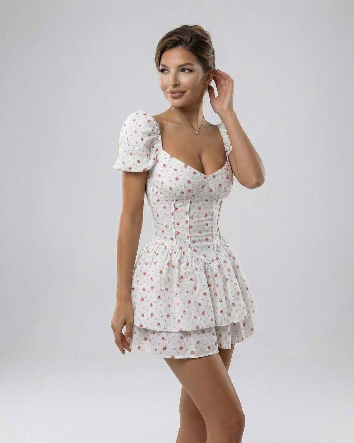 Nima Mini Dress by RAMBLION, white floral design, A-line silhouette, perfect for warm weather occasions.