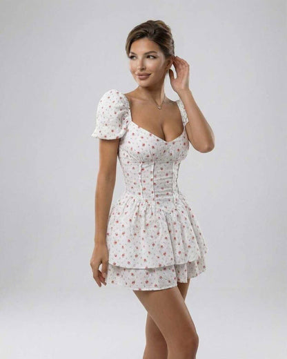Nima Mini Dress by RAMBLION, white floral design, A-line silhouette, perfect for warm weather occasions.