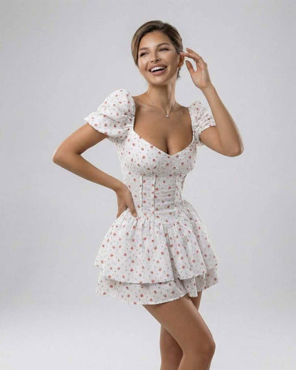 Nima Mini Dress by RAMBLION, white cotton denim with floral print, perfect for warm weather occasions, A-line silhouette.
