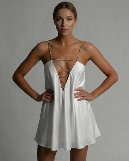 Nina Mini Dress in white satin, featuring a chic A-line silhouette and chain detail. Perfect for elegant occasions - RAMBLION.