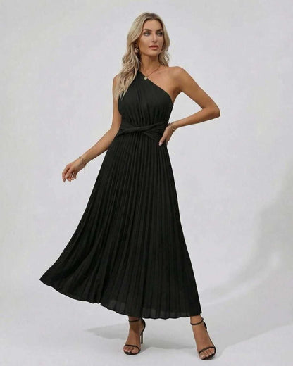 Nova Midi Dress - Elegant one-shoulder twist front with pleated hem in black by RAMBLION.