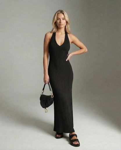 Numa Maxi Dress showcasing its V neck and ribbed design, perfect for chic occasions. From RAMBLION, a modern black dress.