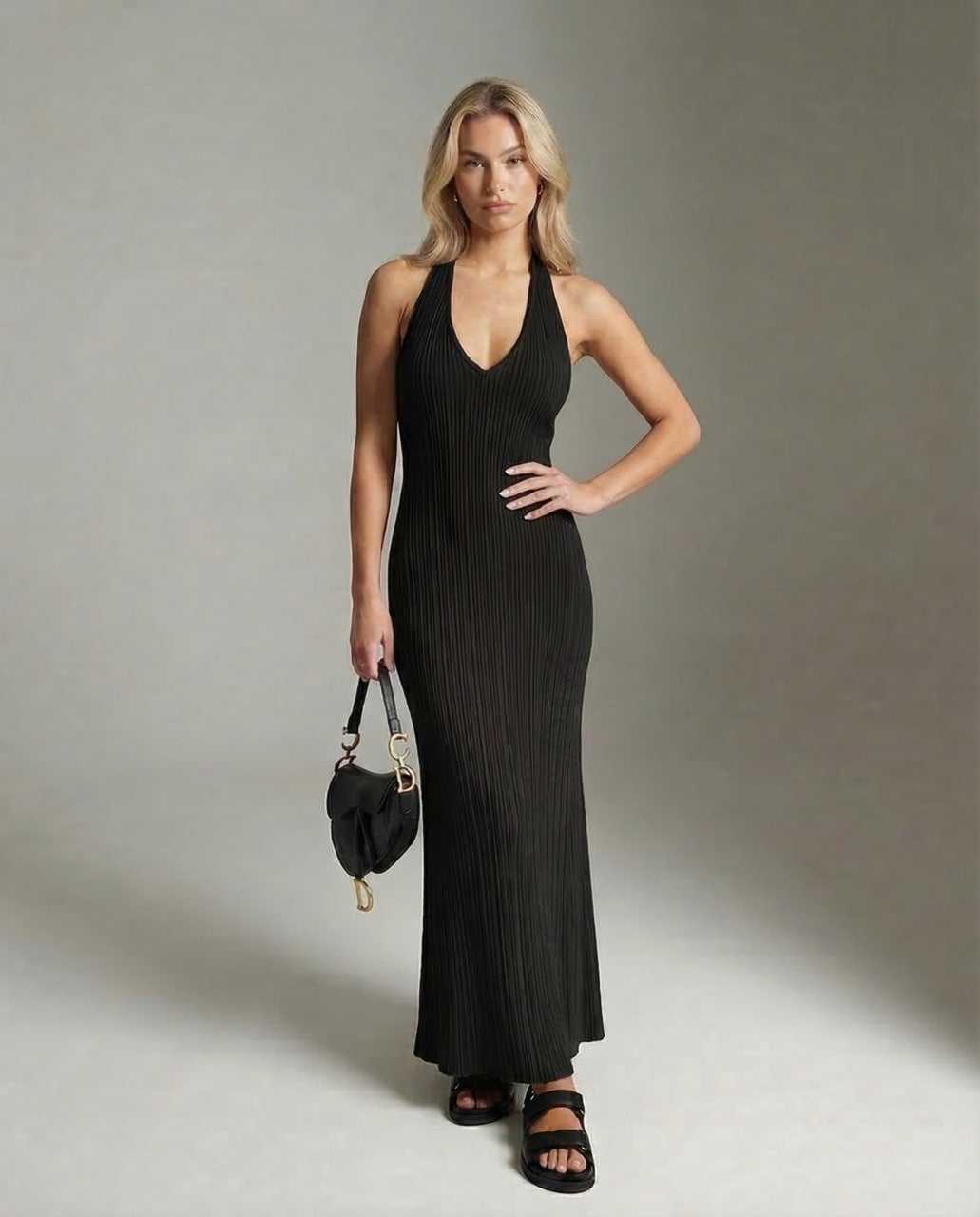 Numa Maxi Dress in black, featuring V-neck, sleek silhouette, ribbed knit fabric, perfect for chic occasions by RAMBLION.