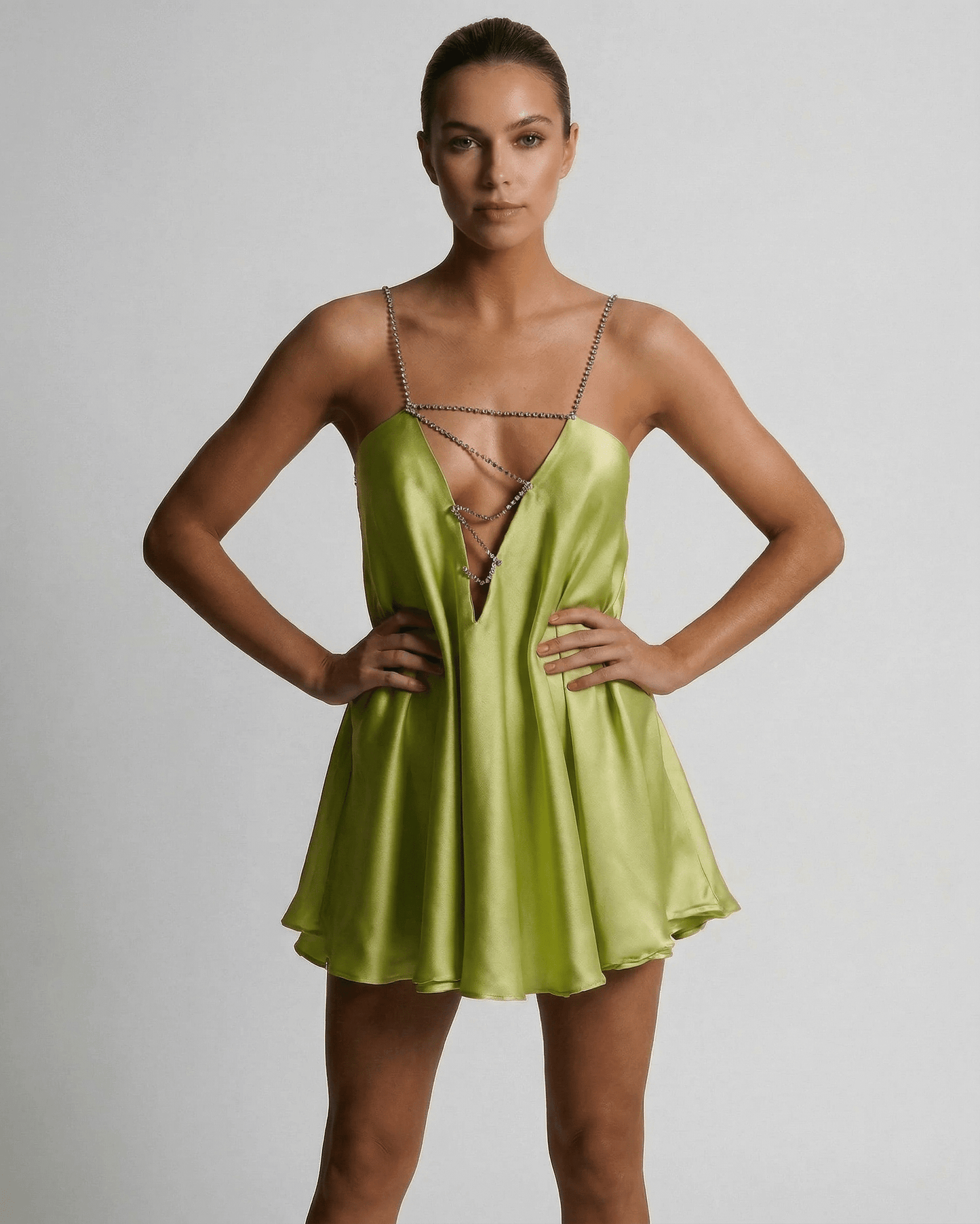 Nyra Mini Dress in vibrant green satin, V neck, A-line silhouette, perfect summer style by RAMBLION.
