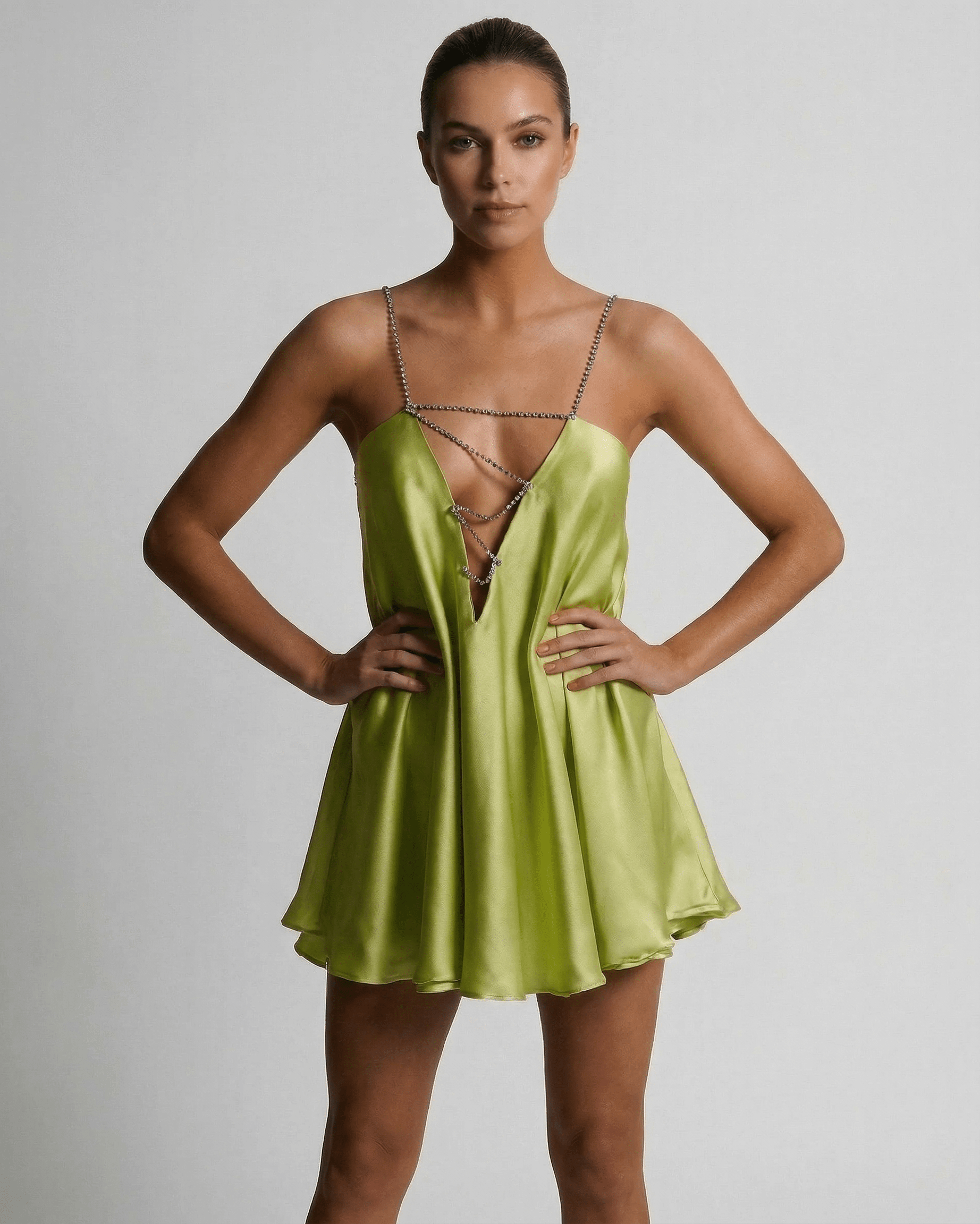 Nyra Mini Dress in vibrant green satin, V neck, A-line silhouette, perfect summer style by RAMBLION.