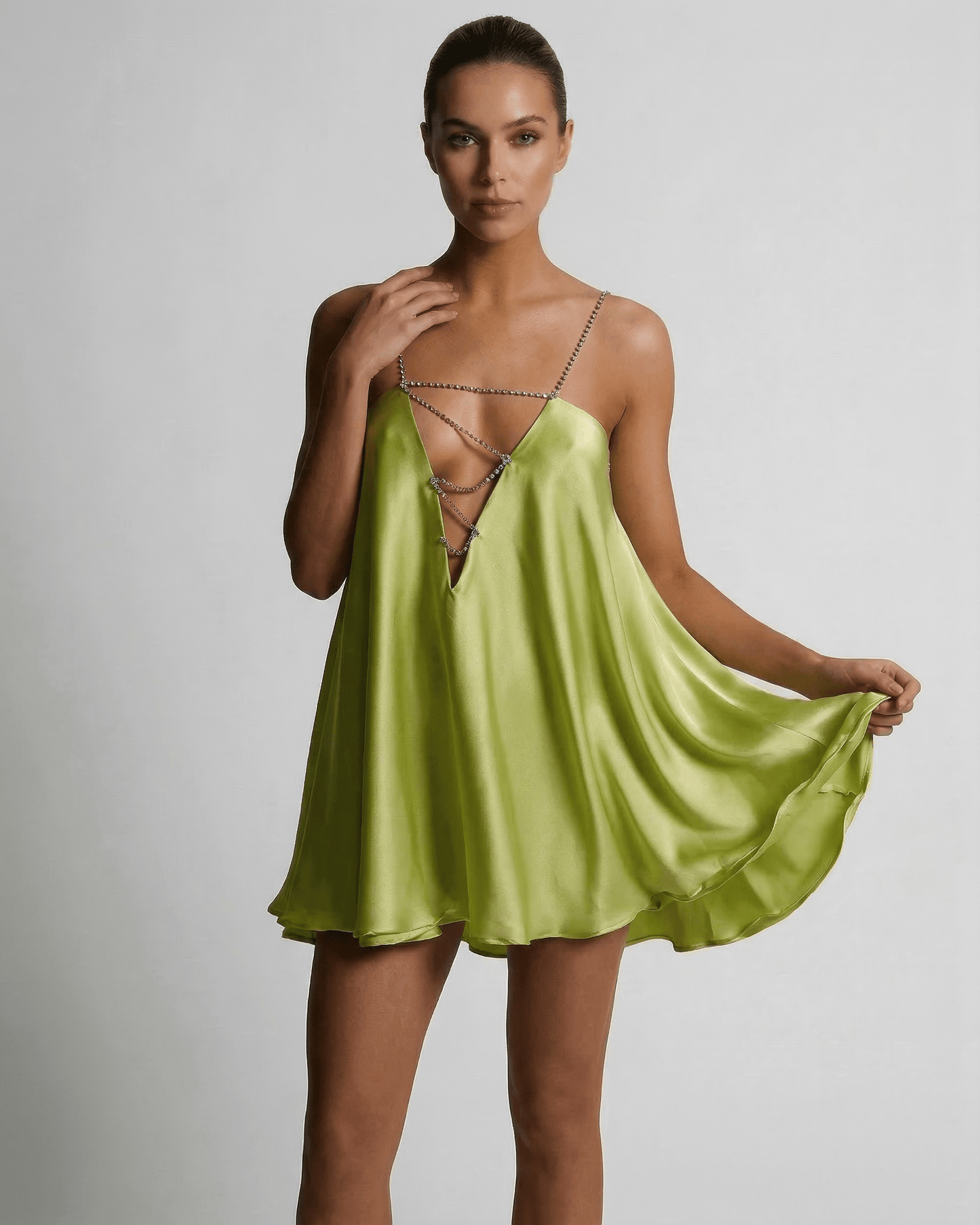 Nyra Mini Dress in vibrant green satin, featuring A-line silhouette, luxurious feel, perfect for summer occasions by RAMBLION.