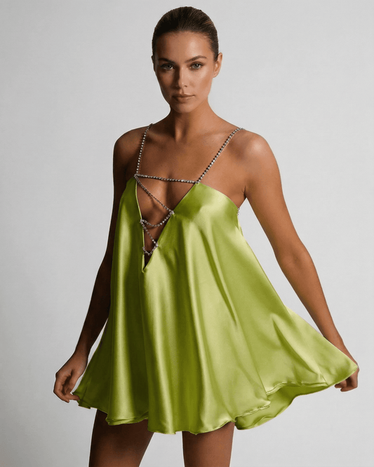 Nyra Mini Dress in vibrant green, satin fabric, V-neck design, perfect for summer occasions, by RAMBLION.