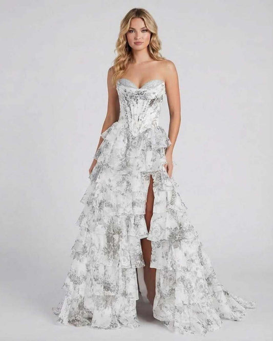 Ora Maxi Dress by RAMBLION, strapless silver gown with tiered ruffles, elegant with high slit, perfect for special occasions.