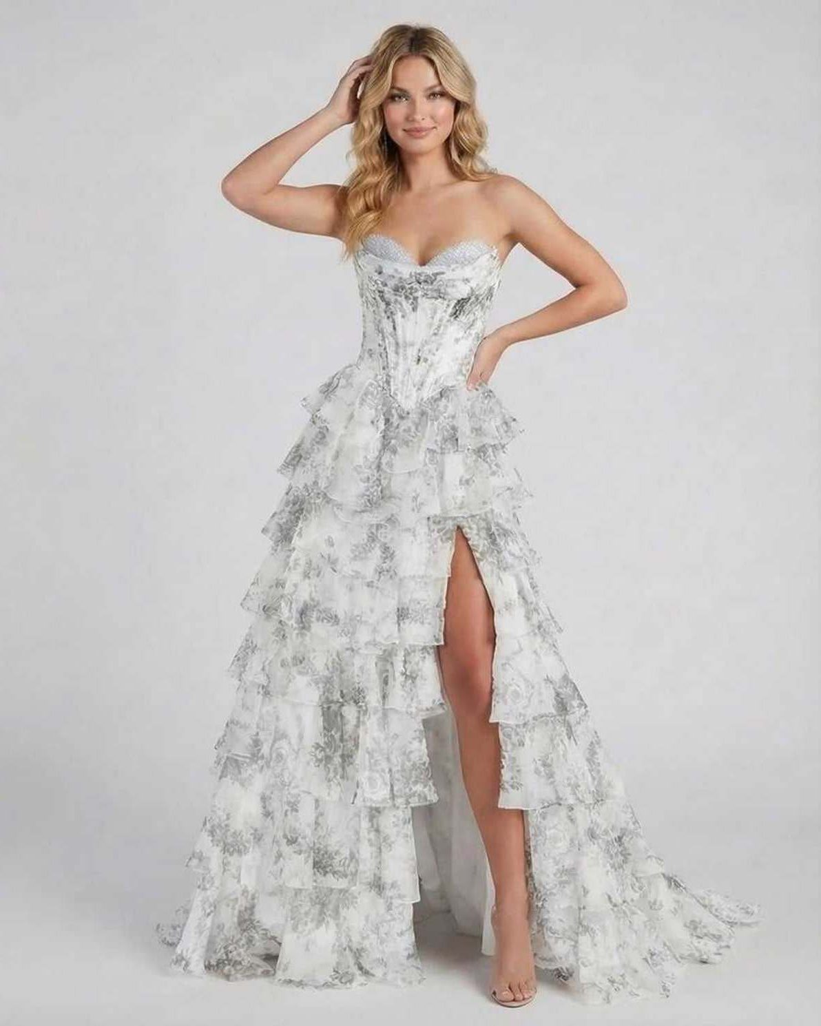 Ora Maxi Dress in silver satin, strapless with tiered ruffles and high slit, by RAMBLION for elegant occasions.