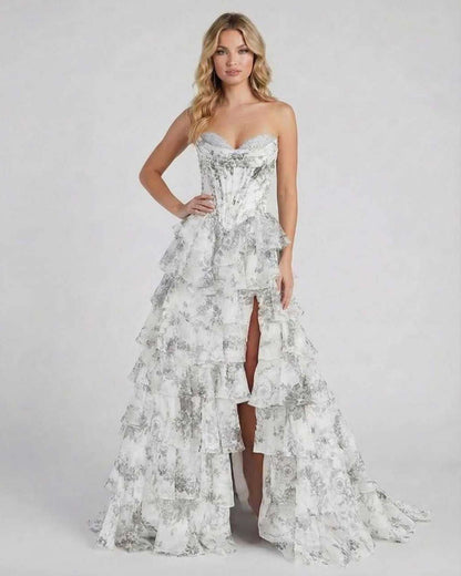Ora Maxi Dress in elegant silver satin with ruffles and high slit, perfect for special occasions, by RAMBLION.