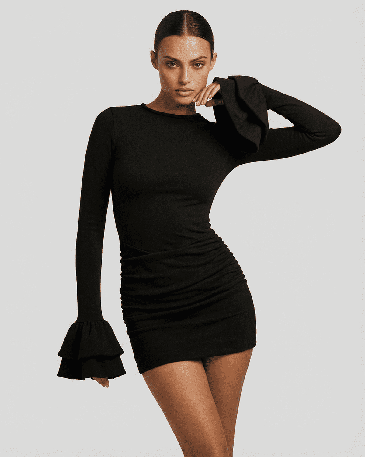 Orion Mini Dress – Elegant black bodycon dress with ruffled sleeves and ruched sides from RAMBLION.