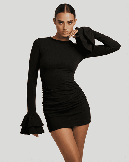 Orion Mini Dress – Elegant black bodycon dress with ruffled sleeves and ruched sides from RAMBLION.