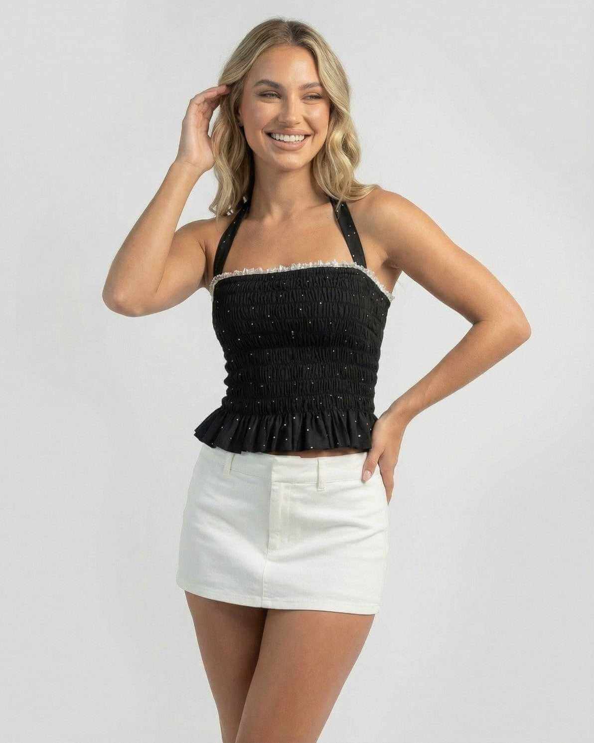 Pala Top: Black Mini Dress with playful polka dots, faux-fur texture, perfect for any occasion by RAMBLION.