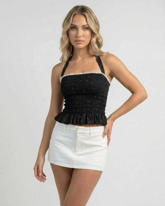 Pala Top by RAMBLION, black mini dress with halter neck, playful polka dots and faux-fur texture, perfect for styling.