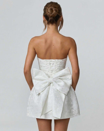 Pixa Mini Dress - Elegant strapless design with a large bow, perfect for summer events, by RAMBLION.