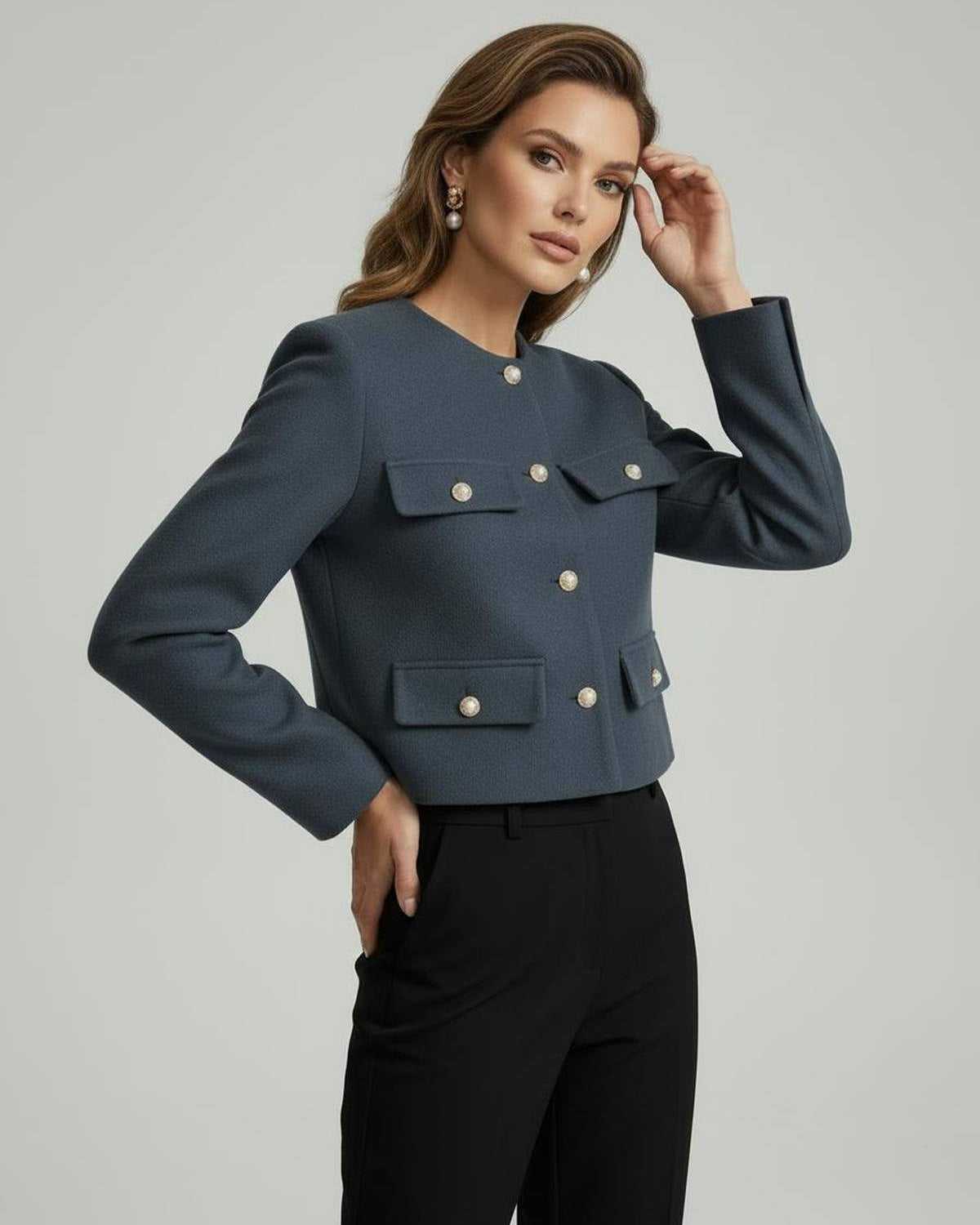 Rage Jacket by RAMBLION in slate blue, cropped design with gold-tone buttons, perfect for chic occasions.