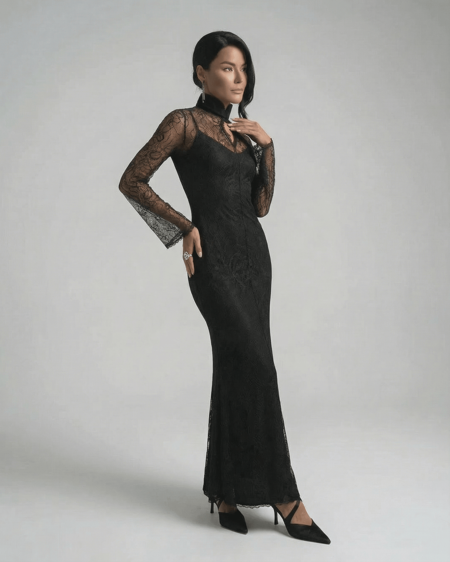 Raia Maxi Dress in black lace featuring round neck and elegant floor-length silhouette by RAMBLION.