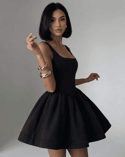 Elegant Xana Mini Dress by RAMBLION, featuring a square neck and playful silhouette, perfect for chic occasions.