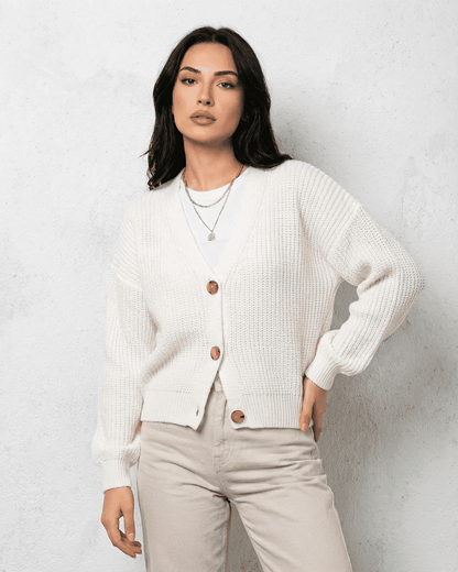 Alba Cardigan – Classic white knitwear with soft V-neck and button detail from RAMBLION.