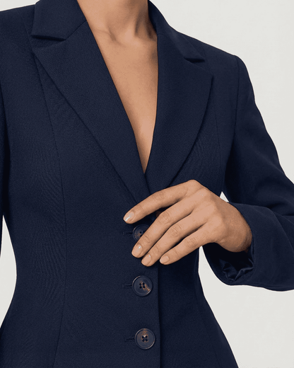 Close-up of the Aurora Blazer showcasing a fitted waist, V-neckline, and structured silhouette by RAMBLION.
