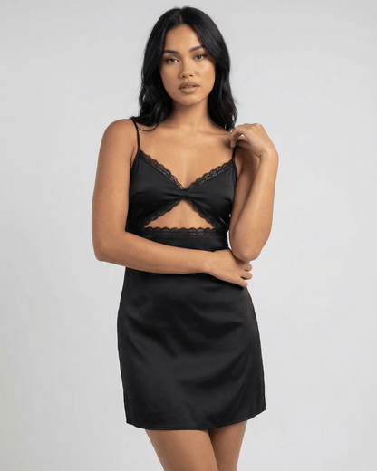 Baux Mini Dress from RAMBLION, a black satin mini dress with lace-trimmed V-neck, elegant for summer outings.