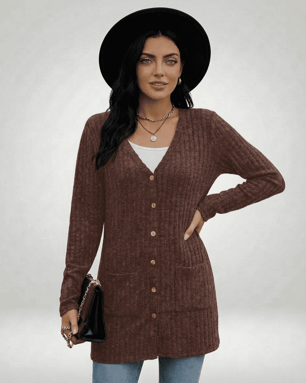 Cairo Cardigan in rich brown with button-front design, paired with a stylish hat and accessories.
