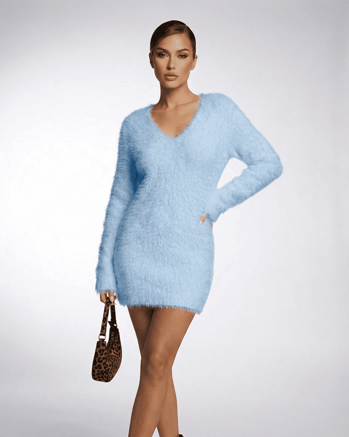 Celeste Sweater in soft blue with V-neck, showcasing plush knit texture and a stylish, cozy fit for women.
