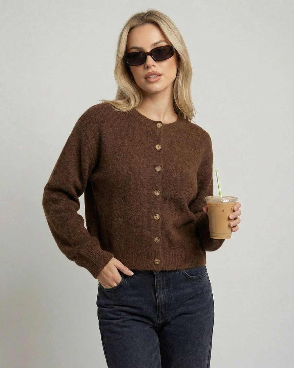 Cocoa Cardigan by RAMBLION, relaxed fit, button-front knit cardigan in brown, styled with sunglasses and iced coffee.