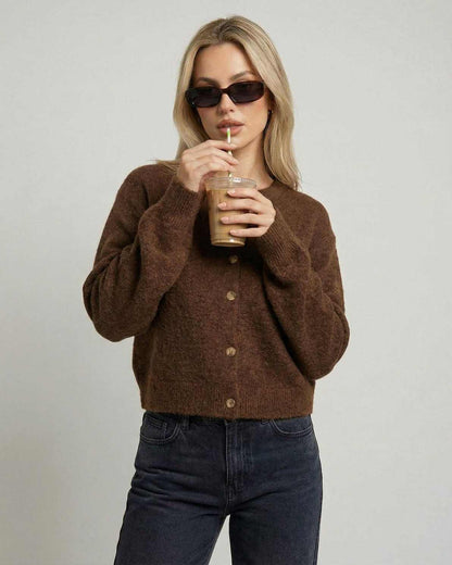 Cocoa Cardigan in brown worn with sunglasses, featuring button-front design and relaxed fit.