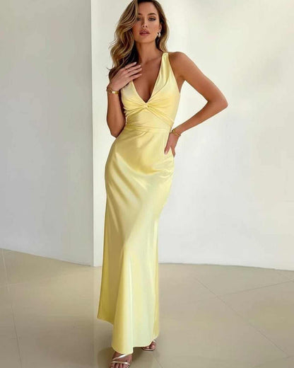 Dotted Maxi Dress by RAMBLION, yellow satin, V-neck, elegant A-line silhouette, perfect for special occasions.