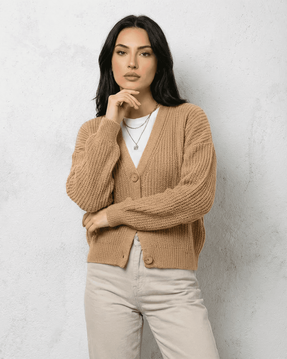 Saffron Cardigan from RAMBLION in soft beige, featuring a relaxed V-neck and cozy knit fit.
