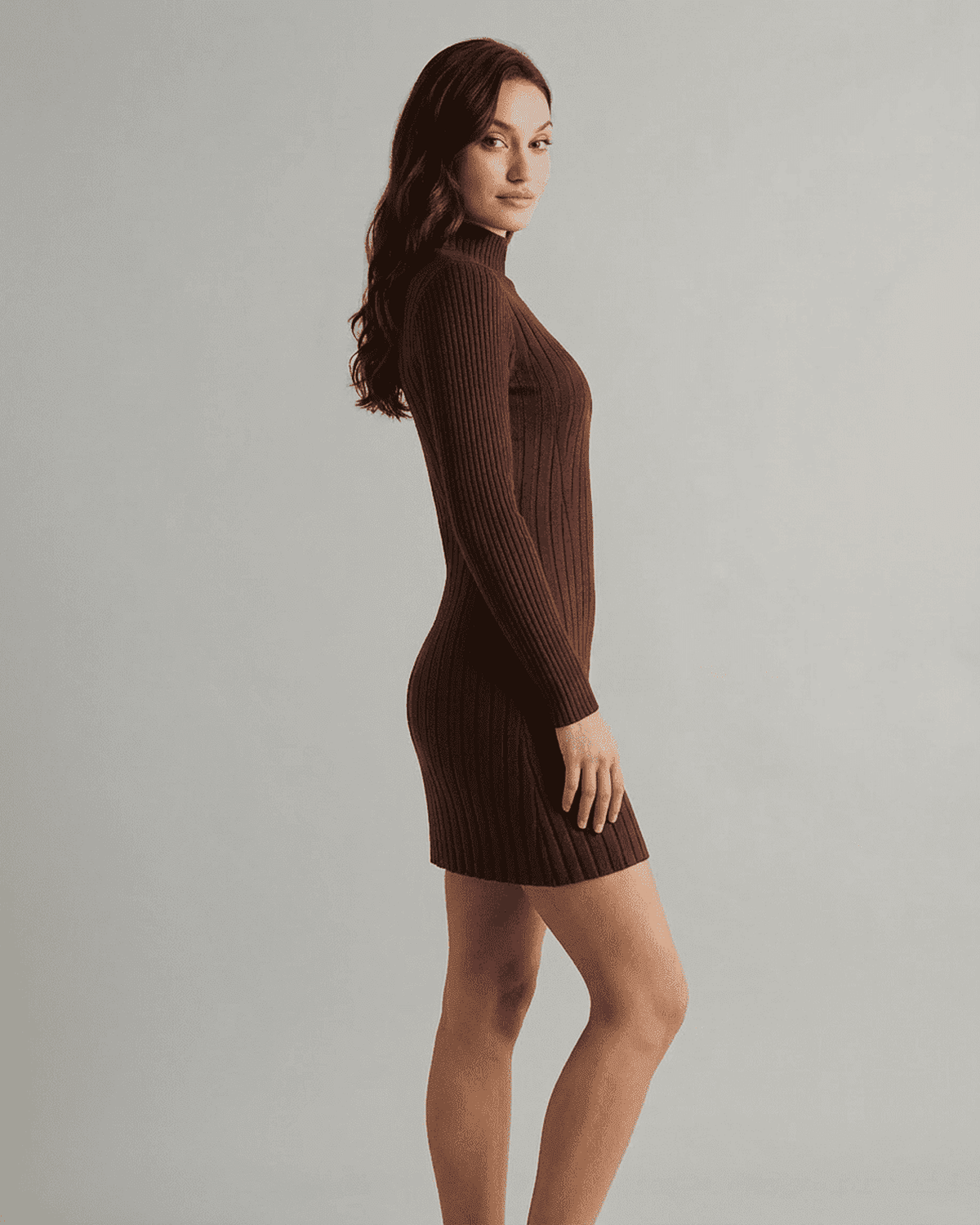 Model wearing RAMBLION Florence Mini Dress in ribbed knit, mock neck, and long sleeves, showcasing A-line silhouette.