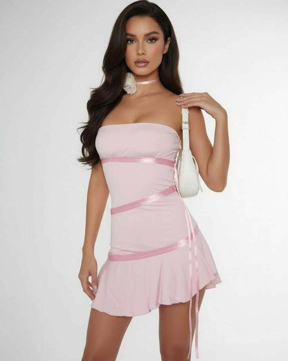 Herringbone Mini Dress in light pink satin, strapless, adorned with ribbon details, perfect for summer occasions by RAMBLION.