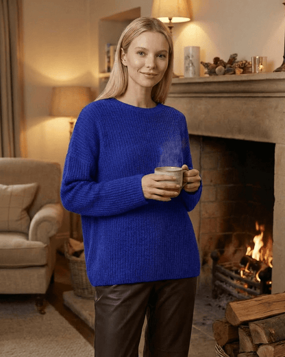 Indira Sweater in vivid blue, loose fit with round neck, perfect for warmth and style in cooler months.