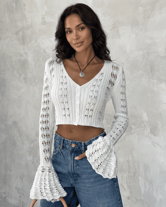 Laceflare Cardigan by RAMBLION – Elegant white cotton knitwear with flare sleeves and hollow-out pattern.