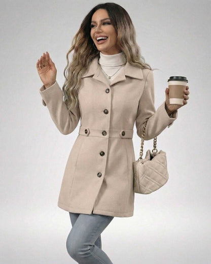 Woman wearing a Latte Sculpt Jacket in beige, paired with a coffee cup and a stylish handbag.