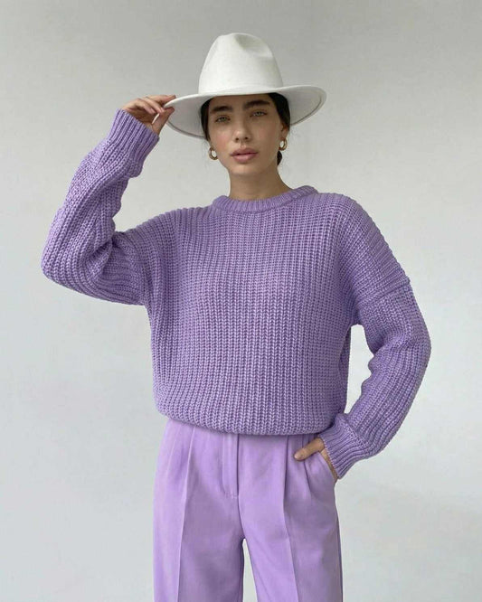 Lavande Sweater in lavender color, textured knit, casual fit, worn with a white hat.