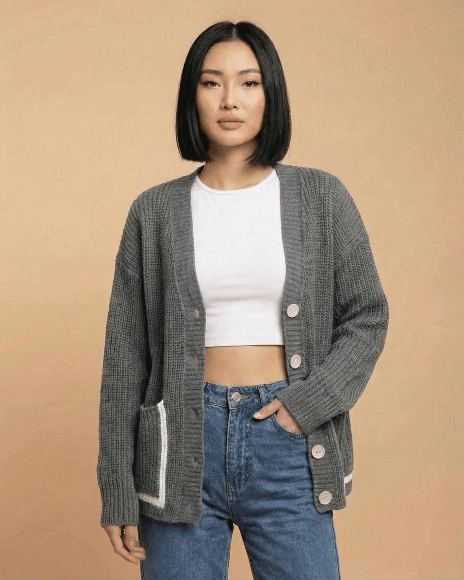 Linden Cardigan displayed on a model, featuring a relaxed V-neck, button-front closure, and color block design.