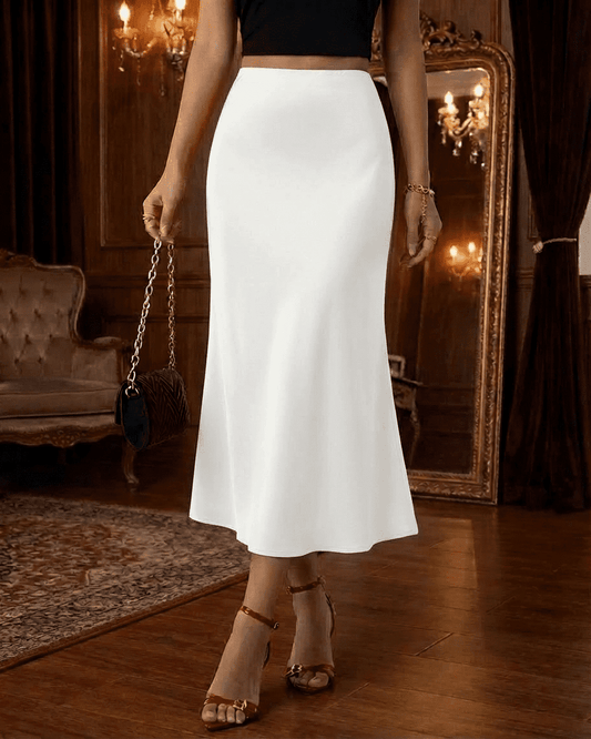 Luna Midi Skirt in white satin, showcasing a mermaid style and elegant silhouette, perfect for modern sophistication.